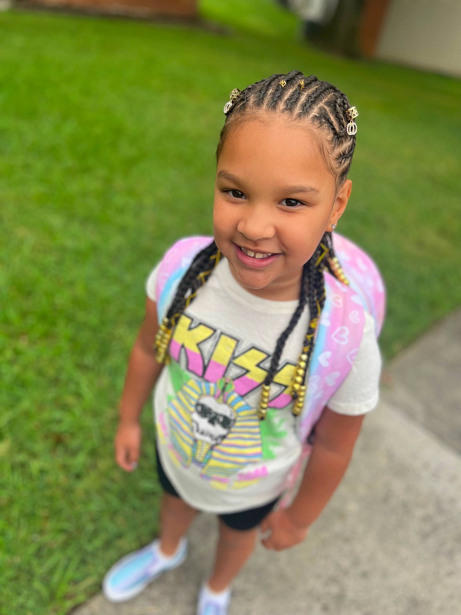 Amari is registered to the contest to win money with this photo: baby, baby_toddler_clothing, child, cool, fashion_accessory, fun, grass, hair_accessory, happy, headband, headpiece, headwear, jewellery, joy, leisure, person, recreation, sandal, shorts, skin