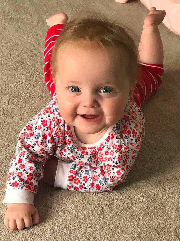 Madison is registered to the contest to win money with this photo: baby, baby_toddler_clothing, cheek, child, crawling, ear, face, facial_expression, head, lip, person, play, skin, smile, toddler