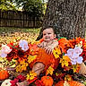 baby, child, infant, autumn, fall, pumpkin, flowers, leaves, outdoor, tree, nature, portrait, smiling, happy, seasonal, harvest, garden, fence, rustic, photography