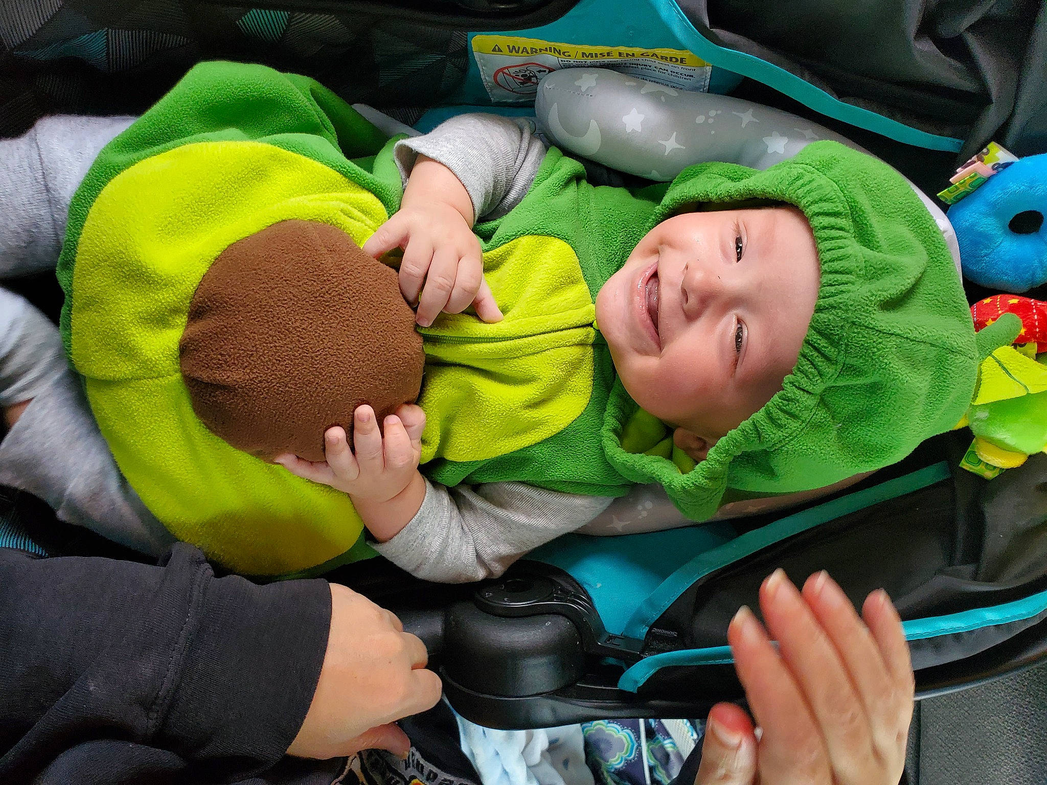 Lucas is registered to the contest to win money with this photo: baby, baby_carriage, baby_products, baby_safety, baby_toddler_clothing, camera, child, comfort, event, fun, grass, green, happy, hat, headwear, joy, leisure, person, personal_protective_equipment, smile