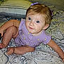 Lenox joined the competition — help win amazing prizes! baby, bedroom, blue_eyes, child, curly_hair, cute, holding_object, indoor, infant, looking_up, patterned_bedspread, person, pillow, portrait, purple_clothing, sitting, skin, small_foot, toddler, young_child