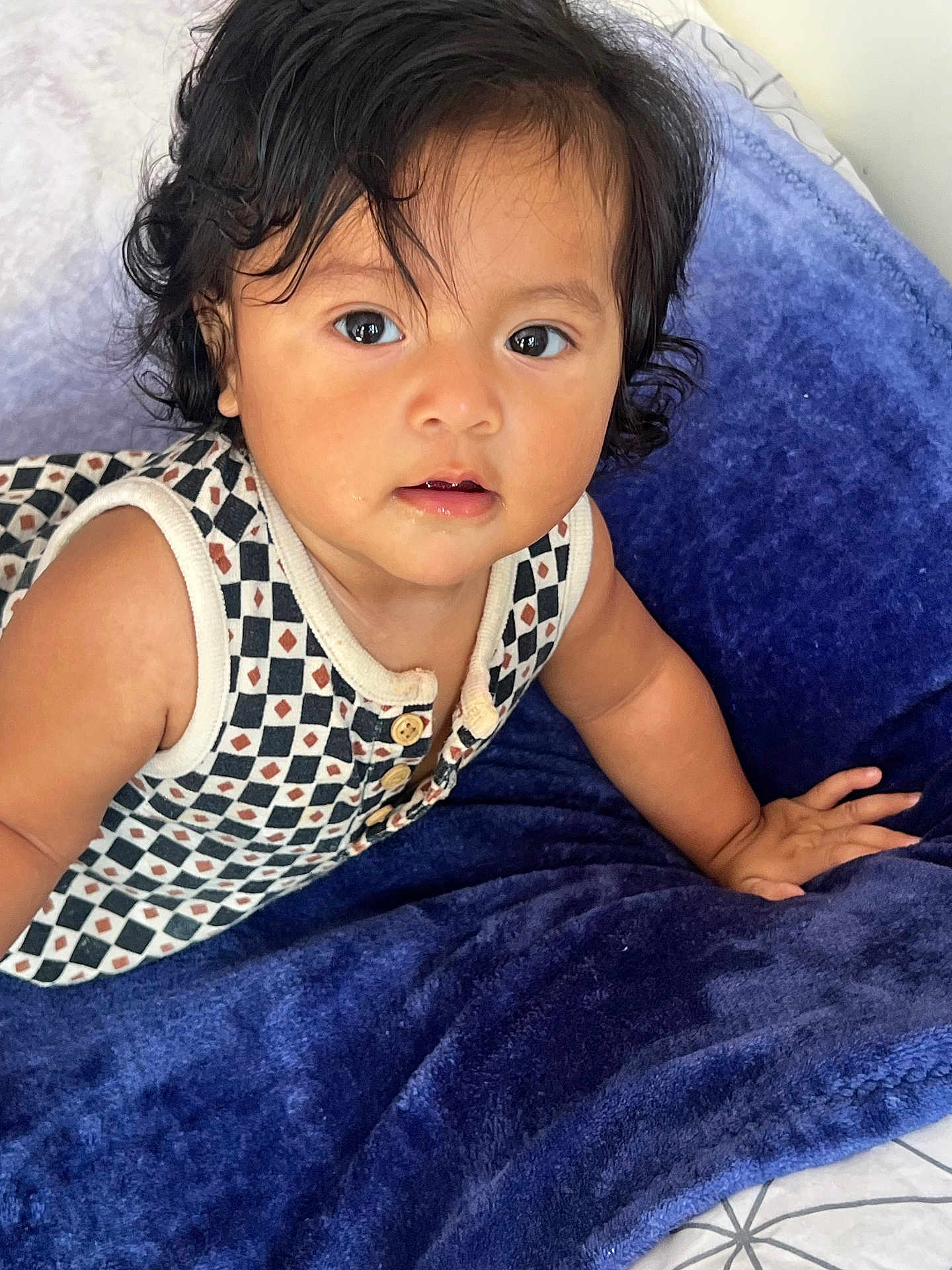 Zoemy joined the competition — help win amazing prizes! baby, child, toddler, face, eyes, hair, curly_hair, blanket, blue_blanket, clothing, patterned_top, sleeveless, hand, skin, indoors, portrait, cute, expression, person, young