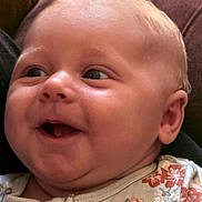 Brinlee is registered to the contest to win money with this photo: baby, smiling, face, child, portrait, clothing, floral, onesie, happy, skin, head, cheek, infant, cute, small, person, human, expression, indoors, closeup