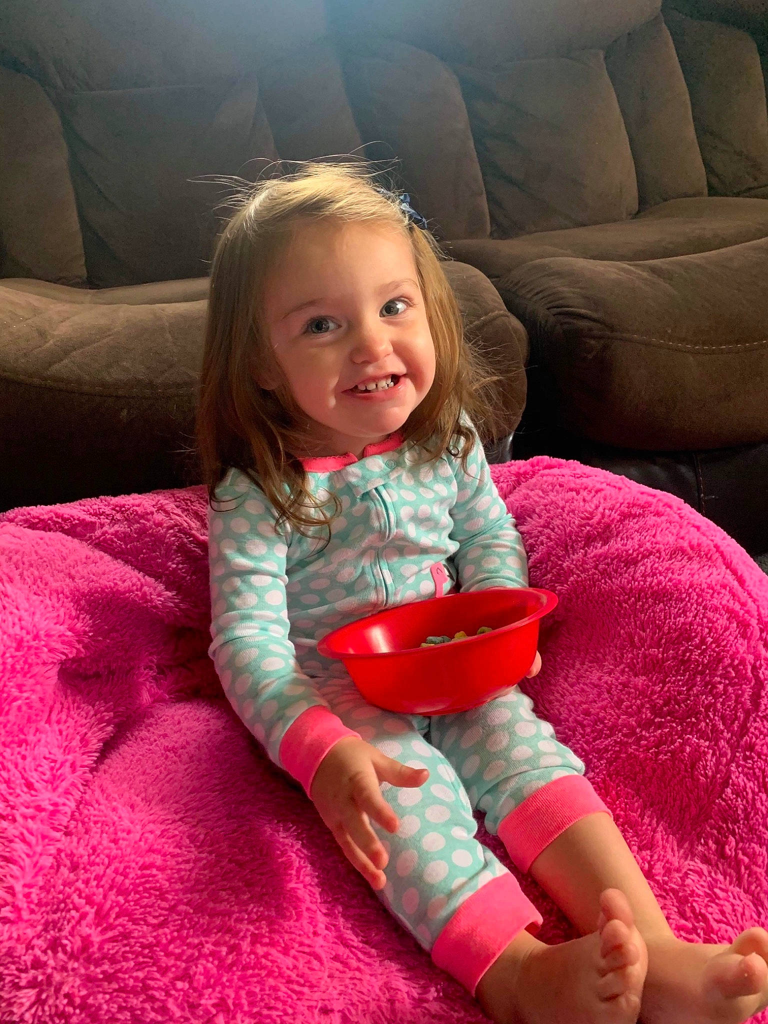 Ayana is registered to the contest to win money with this photo: arm, baby, baby_toddler_clothing, blanket, blond, child, comfort, couch, finger, foot, hand, human_body, joy, linens, living_room, magenta, mouth, person, pink, play