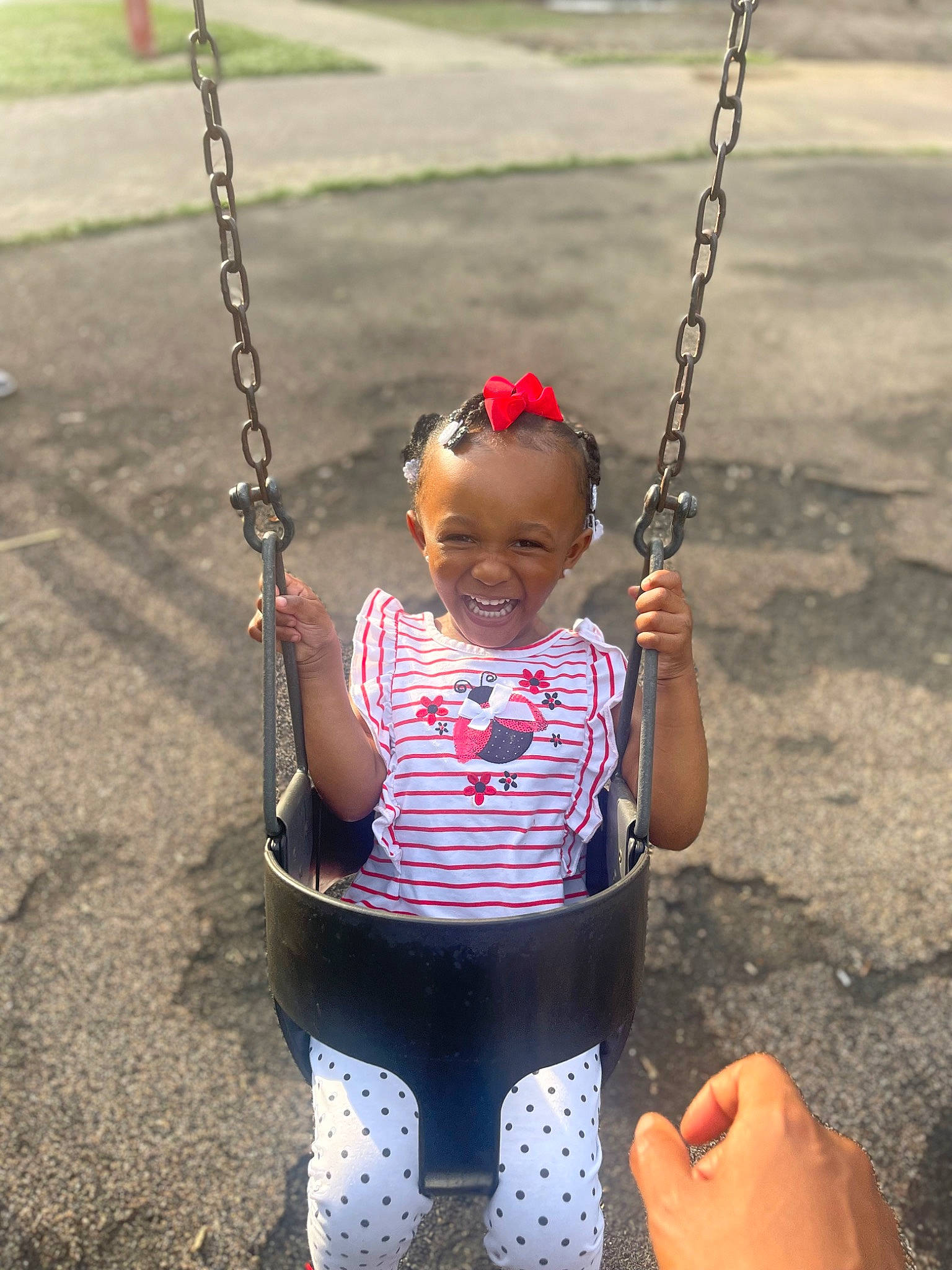 Novah joined the competition — help win amazing prizes! arm, baby, baby_toddler_clothing, black, city, fun, hand, happy, human_body, joy, leisure, person, photograph, playground, product, public_space, recreation, smile, snapshot, swing