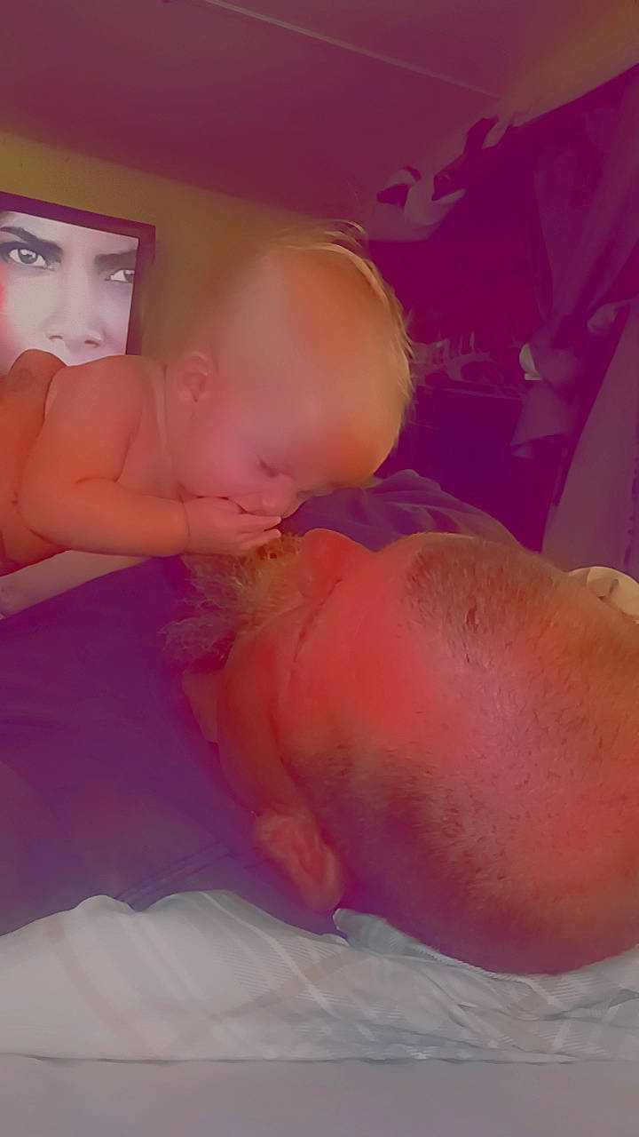 River is registered to the contest to win money with this photo: abdomen, arm, baby, barechested, bathing, chest, comfort, elbow, gesture, happy, human_body, human_leg, mouth, neck, nose, person, pink, stomach, thigh, thumb