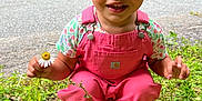 Deava joined the competition — help win amazing prizes! toddler, child, curly_hair, pink_overalls, flower, daisy, grass, outdoor, road, nature, greenery, smiling, happy, portrait, cute, eyes, face, clothing, person, daylight