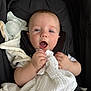 Leandros is registered to the contest to win money with this photo: baby, blanket, blue_eyes, car_seat, child, clothing, comfort, cute, face, hands, infant, plush_toy, portrait, rest, sitting, soft, stroller, toy, white_blanket, young_child