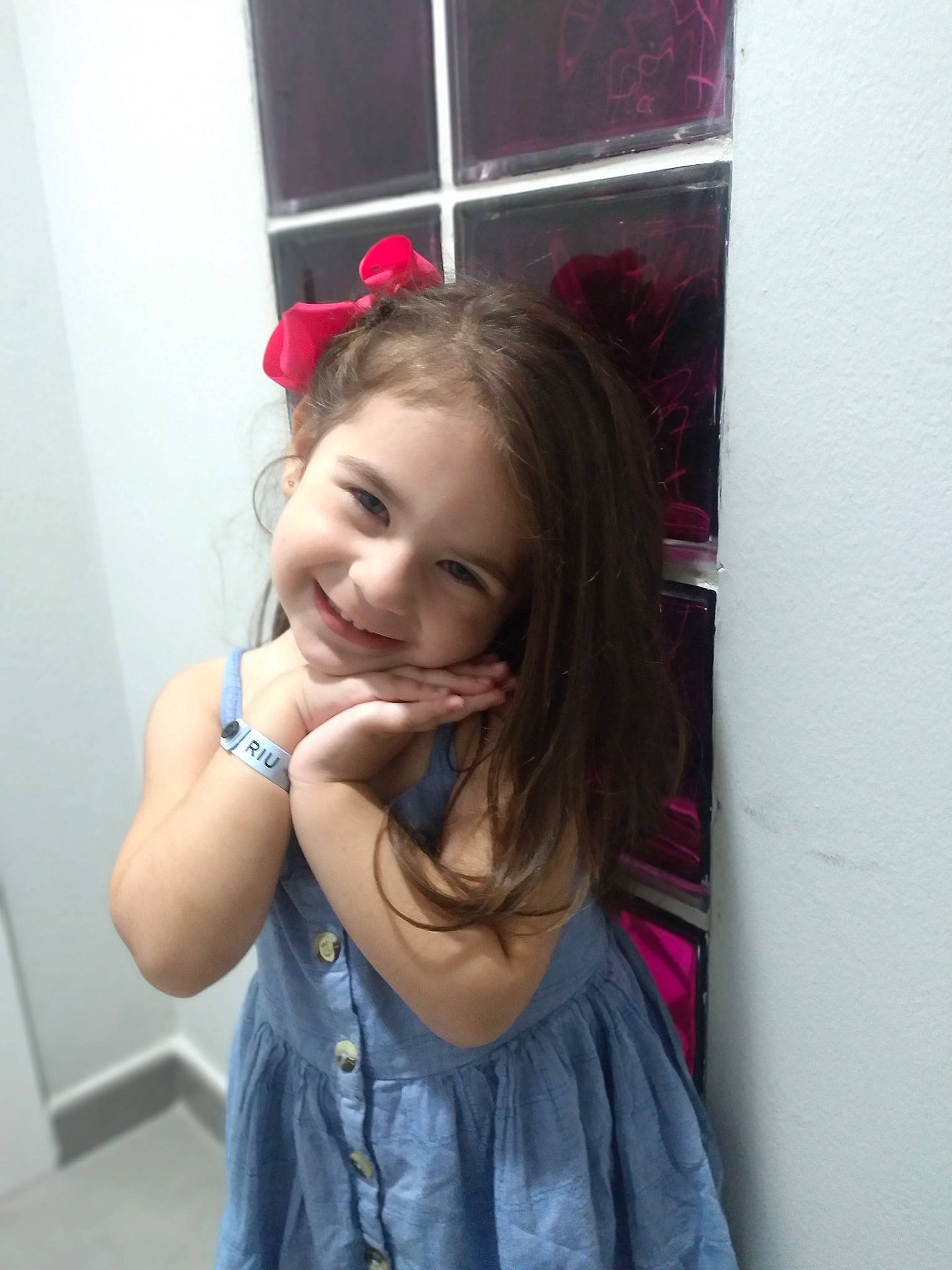 Isabella is registered to the contest to win money with this photo: arm, chin, dress, eye, face, facial_expression, gesture, hair, hairstyle, happy, head, joy, lip, neck, person, pink, purple, skin, sleeve, smile