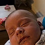 baby, sleeping, infant, blanket, closeup, face, cozy, indoors, soft_light, peaceful, newborn, child, cute, portrait, resting, human, skin, clothing, warm, comfort