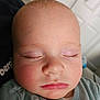 Henry is registered to the contest to win money with this photo: baby, sleeping, face, close_up, infant, rosy_cheeks, eyelashes, soft_clothing, peaceful, indoors, child, cute, portrait, newborn, resting, calm, toddler, head, skin, nap