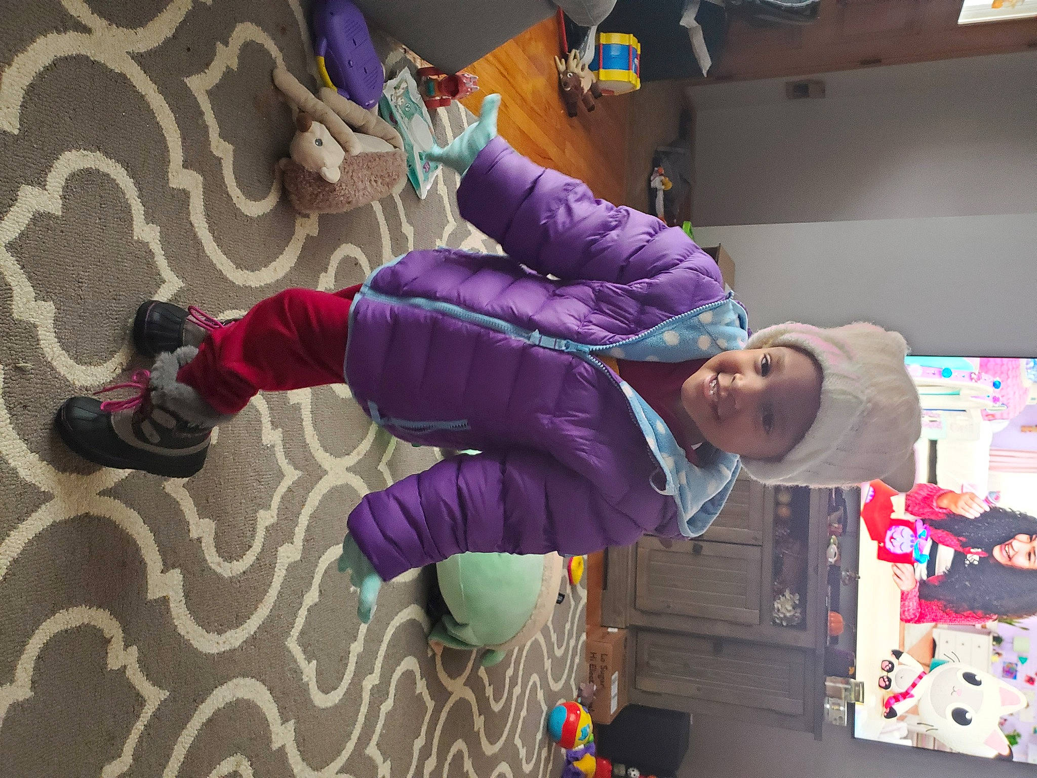 Zahara is registered to the contest to win money with this photo: animation, boot, child, costume, electric_blue, event, fictional_character, flooring, fun, headwear, hoodie, joy, leisure, magenta, person, pink, play, purple, recreation, room