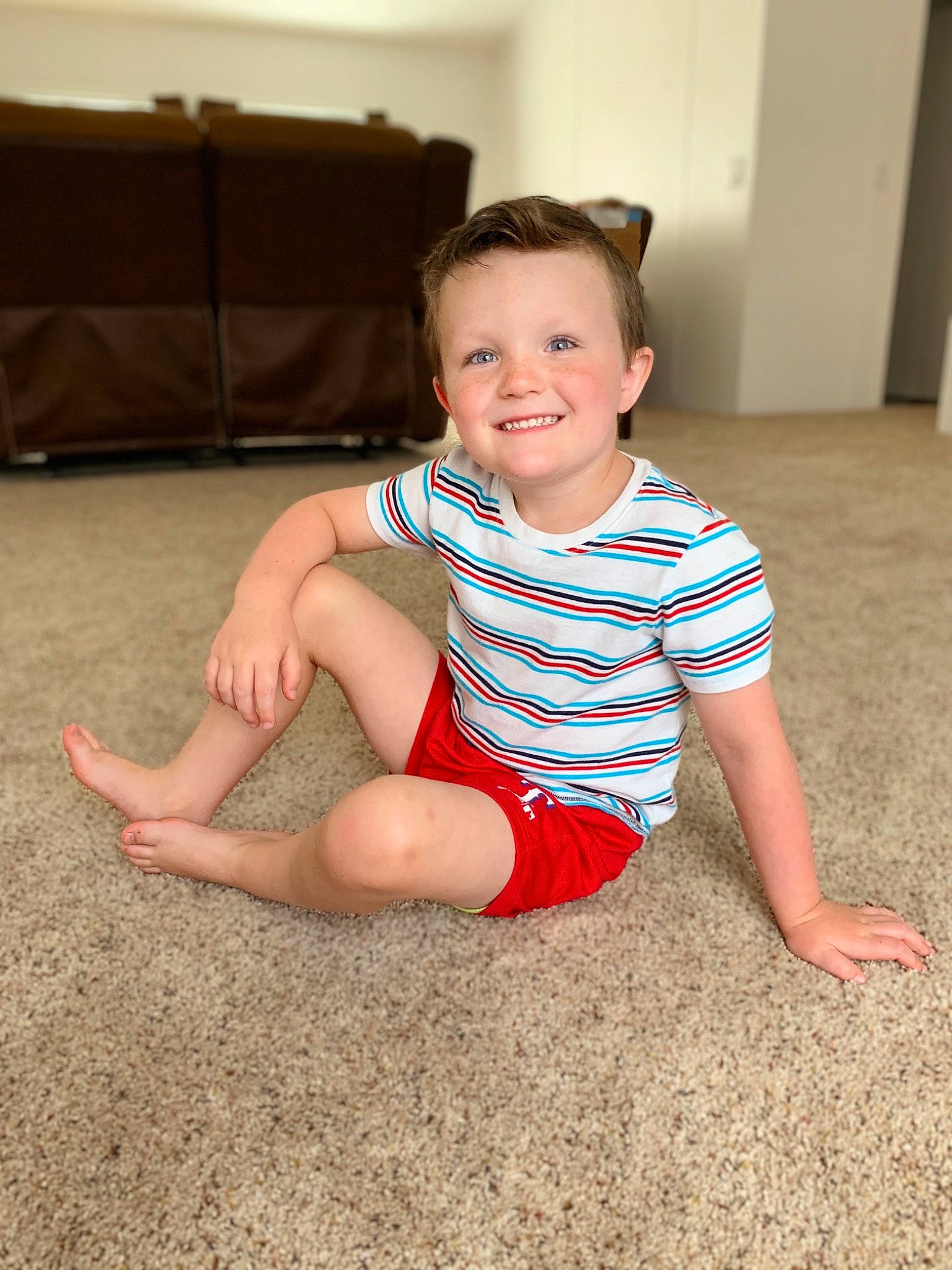 Owen joined the competition — help win amazing prizes! arm, baby, cheek, child, face, facial_expression, floor, flooring, fun, head, joy, leg, people, person, play, red, sitting, skin, smile, summer