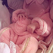 Eleanna participe au concours pour gagner de l'argent avec cette photo : baby, bow, carrier, clothing, cozy, cushion, cute, fabric, fluffy, hands, infant, lace, newborn, pink, rest, sleep, socks, soft, warm, zipper