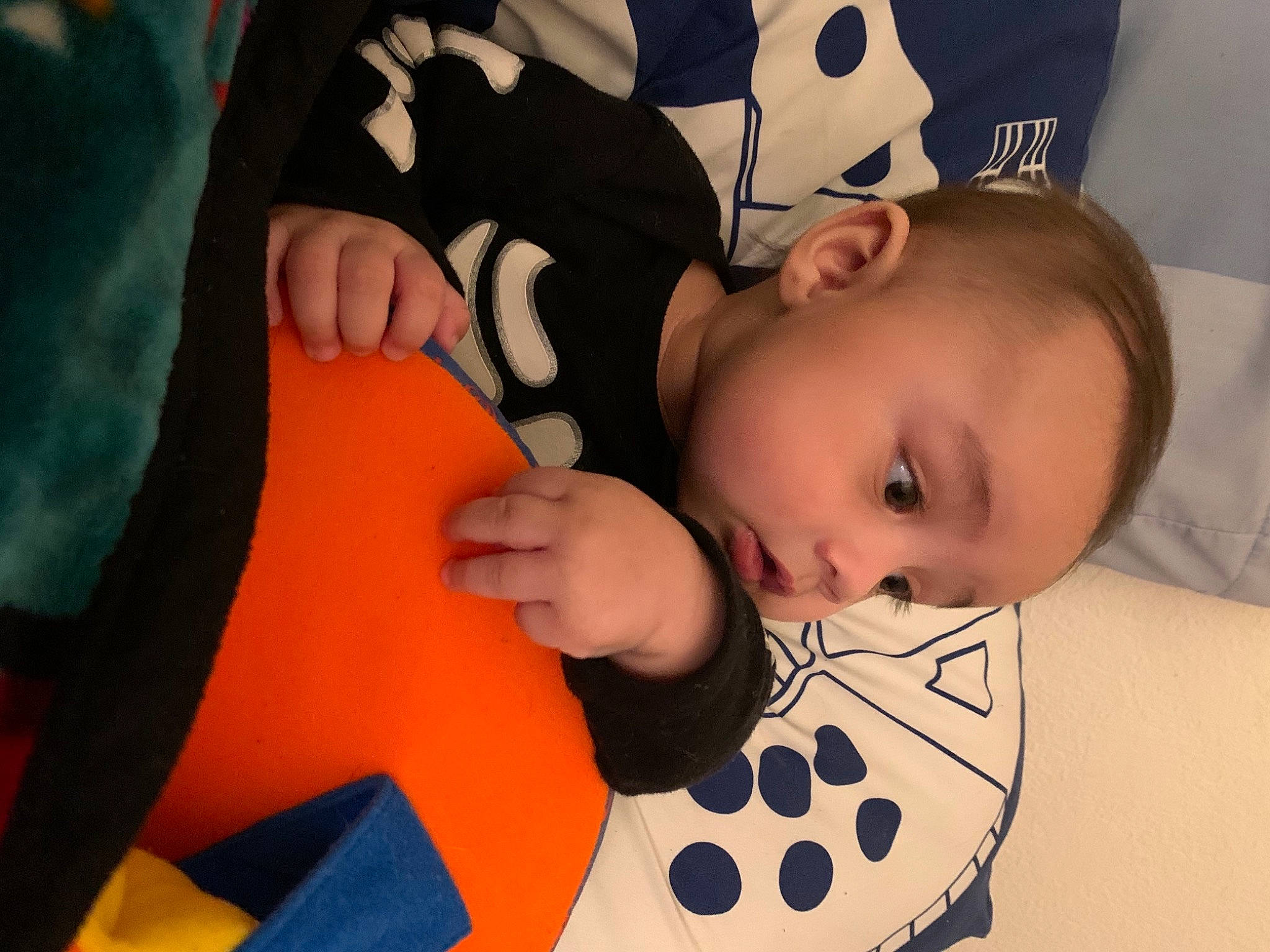 Flynn joined the competition — help win amazing prizes! arm, baby, baby_toddler_clothing, cheek, child, comfort, facial_expression, finger, fun, gesture, happy, head, mouth, orange, person, product, sleeve, textile, toddler, white