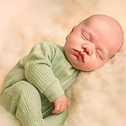 Leo joined the competition — help win amazing prizes! baby, sleeping, infant, onesie, mint_green, ribbed_clothing, soft_texture, fluffy_blanket, peaceful, cozy, newborn, resting, cute, portrait, child, nursery, soft_lighting, warm_colors, closeup, adorable