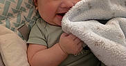 Zaire joined the competition — help win amazing prizes! baby, bed, blanket, child, clothing, cozy, cuddling, eyes, face, hands, happy, indoor, infant, photography, pillow, portrait, seated, smiling, soft, warm_lighting