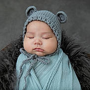Kai is registered to the contest to win money with this photo: adorable, baby, bear_ears, blue_wrap, child, closeup, cozy, cute, fluffy_blanket, headwear, infant, knitted_hat, newborn, peaceful, portrait, resting, sleeping, soft_texture, warm, wrapped