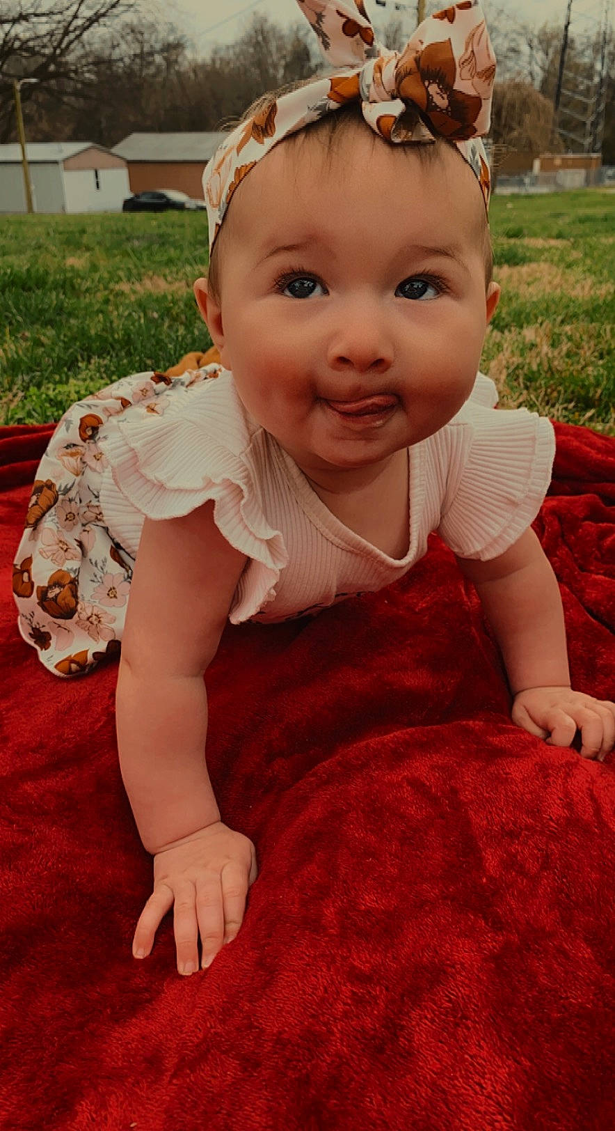 Kenzley joined the competition — help win amazing prizes! baby, baby_toddler_clothing, beauty, cheek, child, facial_expression, flooring, fun, grass, happy, headband, headpiece, leaf, person, pink, plant, sitting, skin, smile, textile