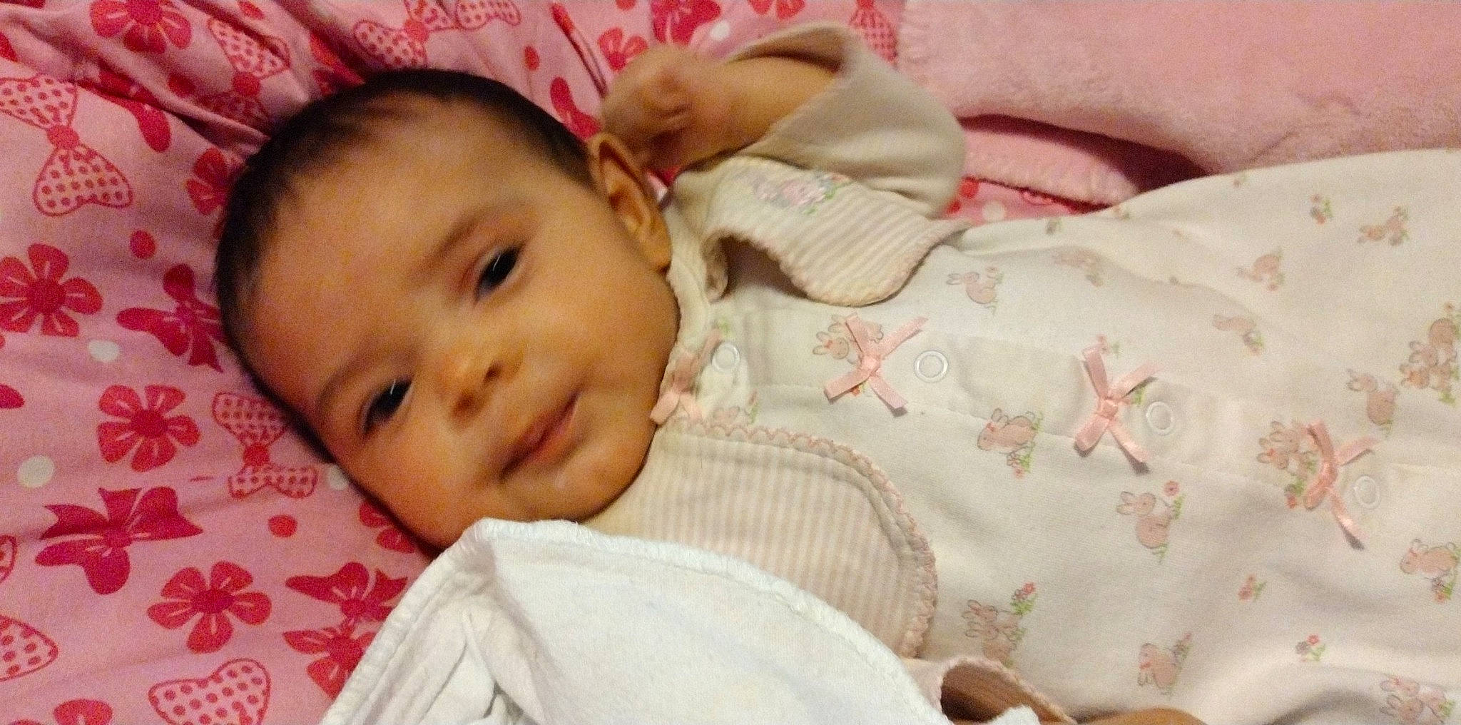 Emelia joined the competition — help win amazing prizes! baby, baby_toddler_clothing, cheek, child, comfort, eyebrow, eyelash, grass, happy, human_body, iris, linens, lip, nose, pattern, person, pink, skin, sleeve, smile