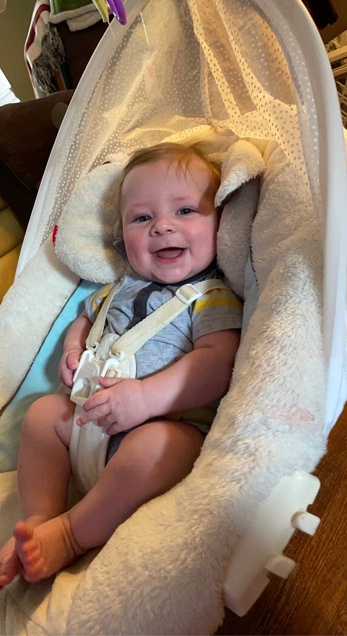 Corbyn joined the competition — help win amazing prizes! baby, baby_products, baby_toddler_clothing, blond, chair, cheek, child, comfort, finger, happy, infant_bed, iris, linens, person, product, room, sitting, skin, smile, textile