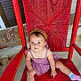 Nyree joined the competition — help win amazing prizes! toddler, child, red_chair, purple_dress, headband, socks, outdoor, brick_wall, concrete_floor, woven_chair, cute, sitting, portrait, baby, person, smile, relaxed, colorful, casual, young_child