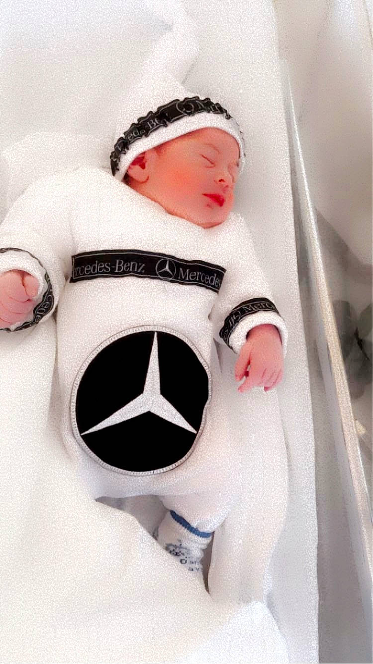 Djeylon participe au concours pour gagner de l'argent avec cette photo : arm, baby, baby_sleeping, baby_toddler_clothing, cap, comfort, finger, football, hand, headgear, neck, outerwear, person, pink, sleeve, sports_gear, stuffed_toy, t_shirt, textile, thumb