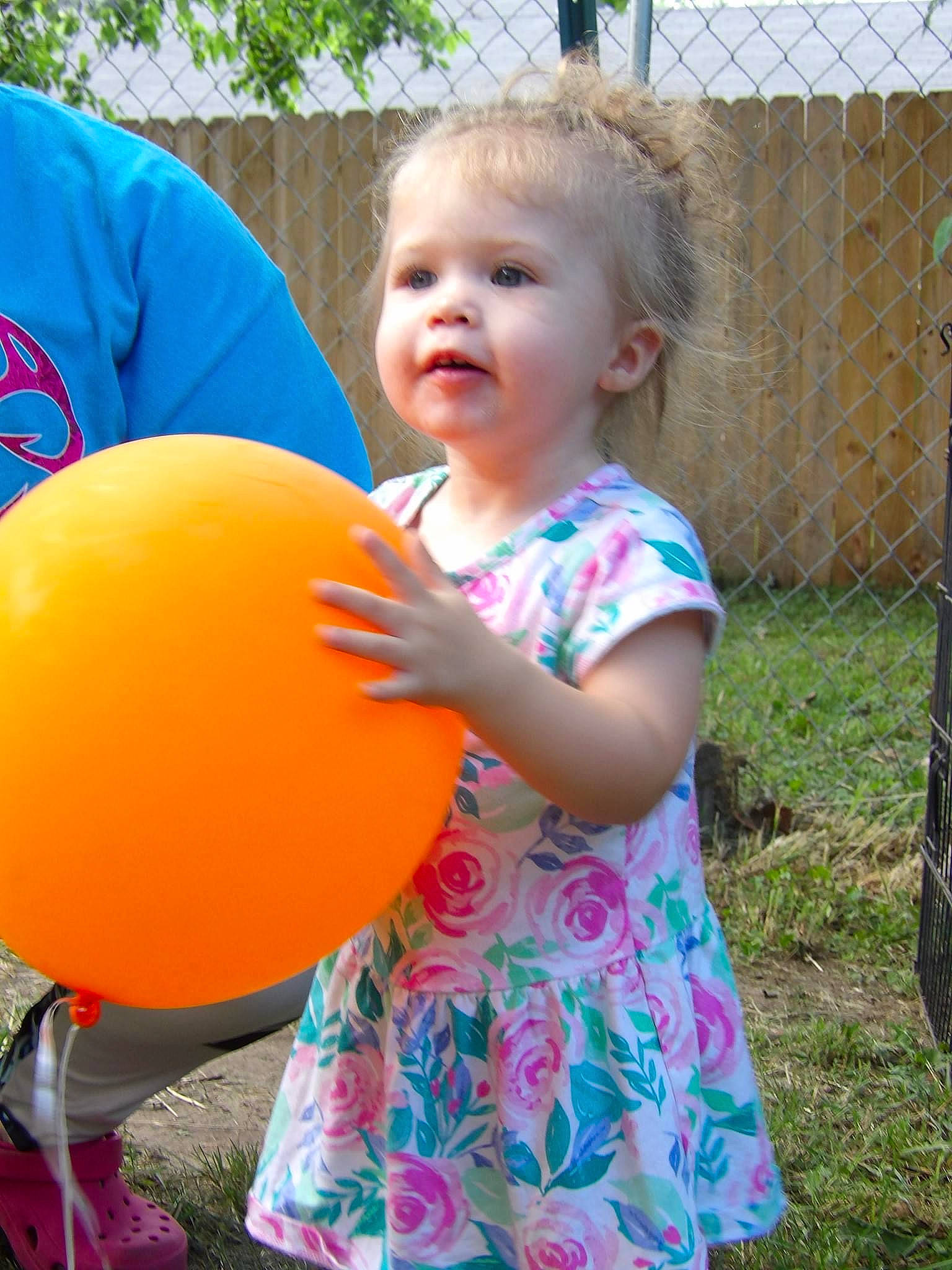 Nova is registered to the contest to win money with this photo: baby, baby_toddler_clothing, balloon, child, event, fun, grass, happy, leisure, mammal, party_supply, people_in_nature, person, pink, play, public_space, recreation, standing, summer, t_shirt