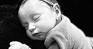 Halo joined the competition — help win amazing prizes! baby, black_and_white, blanket, close_up, closed_eyes, cozy, cuddle, face, headband, indoors, infant, knit_clothing, monochrome, newborn, peaceful, photography, portrait, resting, sleeping, soft_lighting