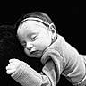 Halo joined the competition — help win amazing prizes! baby, black_and_white, blanket, close_up, closed_eyes, cozy, cuddle, face, headband, indoors, infant, knit_clothing, monochrome, newborn, peaceful, photography, portrait, resting, sleeping, soft_lighting