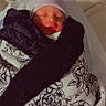 newborn, baby, sleeping, infant, portrait, hospital_bed, blanket, swaddled, hat, striped_hat, floral_blanket, face, closed_eyes, indoors, cozy, bed, nursery, peaceful, photography, cute