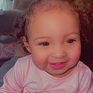 Juniper joined the competition — help win amazing prizes! toddler, child, smiling, curly_hair, pink_shirt, indoor, portrait, cute, happy, young_child, person, baby, face, clothing, sitting, cozy, home, expression, cute_face, warm_lighting