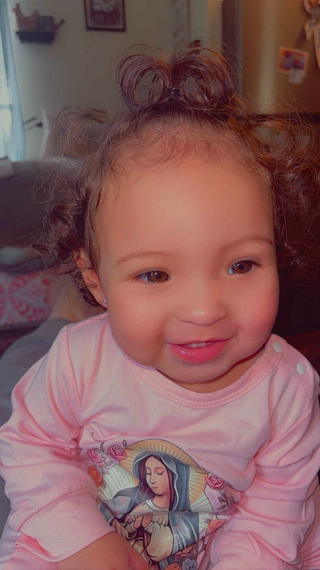 Juniper joined the competition — help win amazing prizes! toddler, child, smiling, curly_hair, pink_shirt, indoor, portrait, cute, happy, young_child, person, baby, face, clothing, sitting, cozy, home, expression, cute_face, warm_lighting