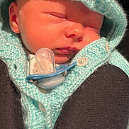 Finley joined the competition — help win amazing prizes! newborn, baby, sleeping, pacifier, knitwear, hooded_sweater, cozy, infant, peaceful, closeup, soft_light, cute, child, warmth, portrait, tiny, face, bundle, comfort, rest