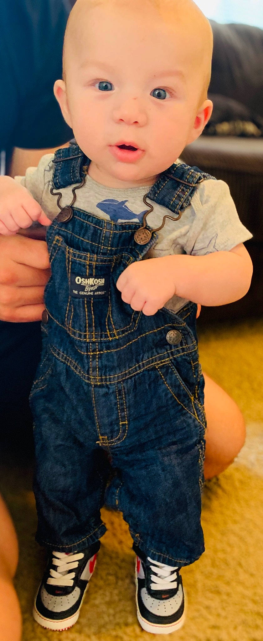 August is registered to the contest to win money with this photo: baby_toddler_clothing, blue, collar, denim, doll, electric_blue, eyewear, fashion_design, finger, hand, joint, lip, neck, pattern, person, skin, sleeve, street_fashion, toy, trunk