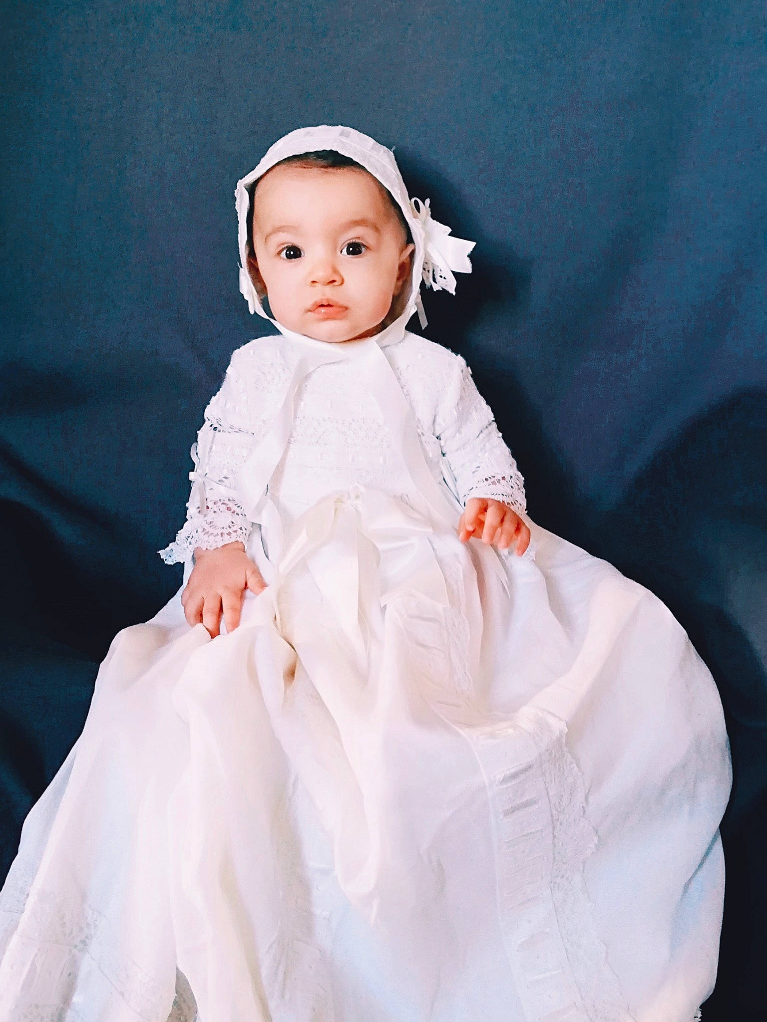 Agatha participe au concours pour gagner de l'argent avec cette photo : baby, bridal_accessory, bridal_clothing, bridal_party_dress, child, clothing, doll, dress, formal_wear, gown, hair_accessory, headgear, headpiece, person, skin, sleeve, textile, toddler, wedding_dress, white