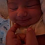 baby, smile, hand, face, blanket, cozy, newborn, sleeping, child, skin, closeup, soft, warm, cuddle, infant, portrait, tender, comfort, peaceful, cute