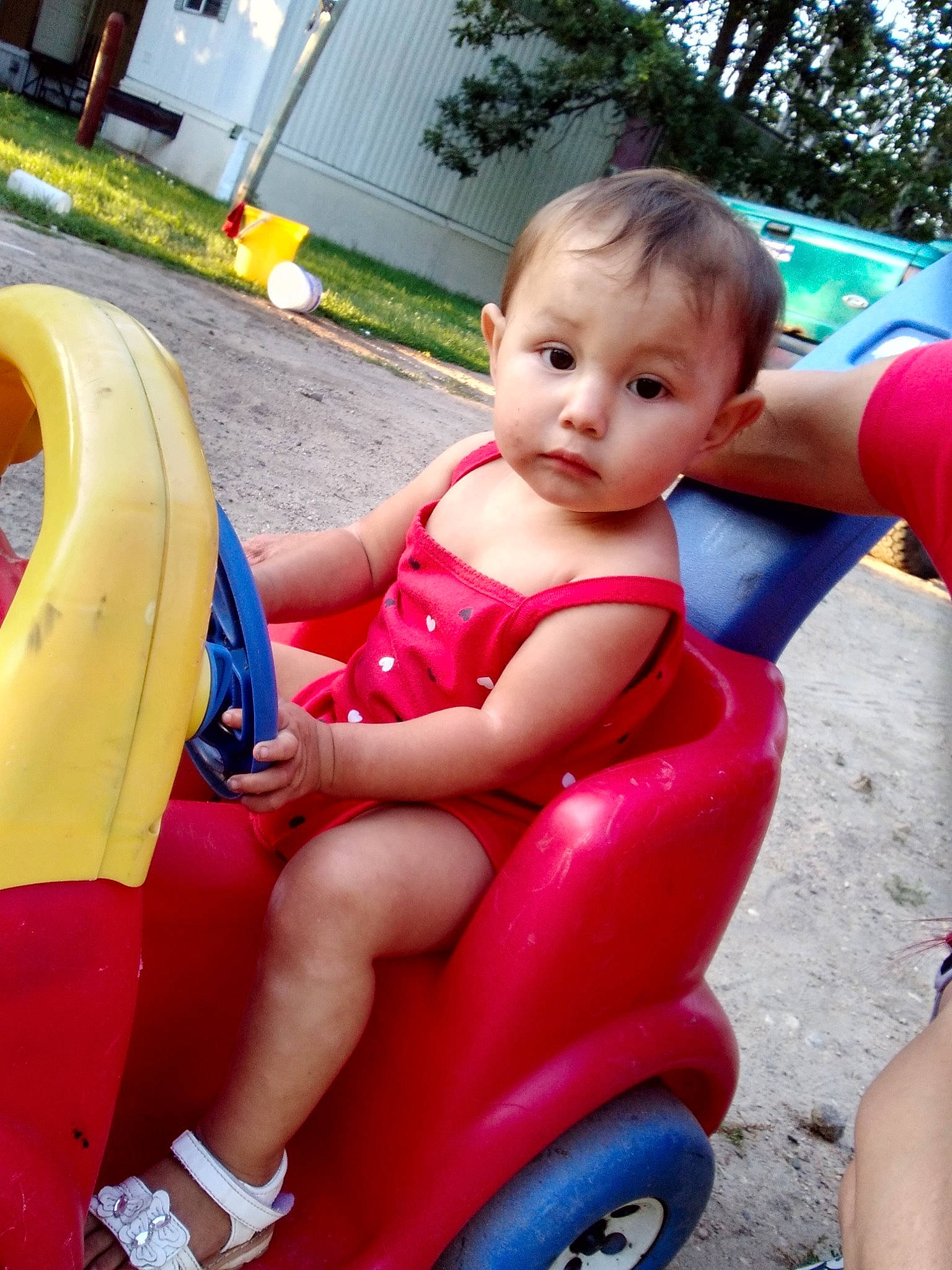 Luciana is registered to the contest to win money with this photo: baby, baby_products, child, fun, leg, leisure, outdoor_play_equipment, person, play, playground, product, public_space, riding_toy, sitting, smile, summer, toddler, vacation, vehicle