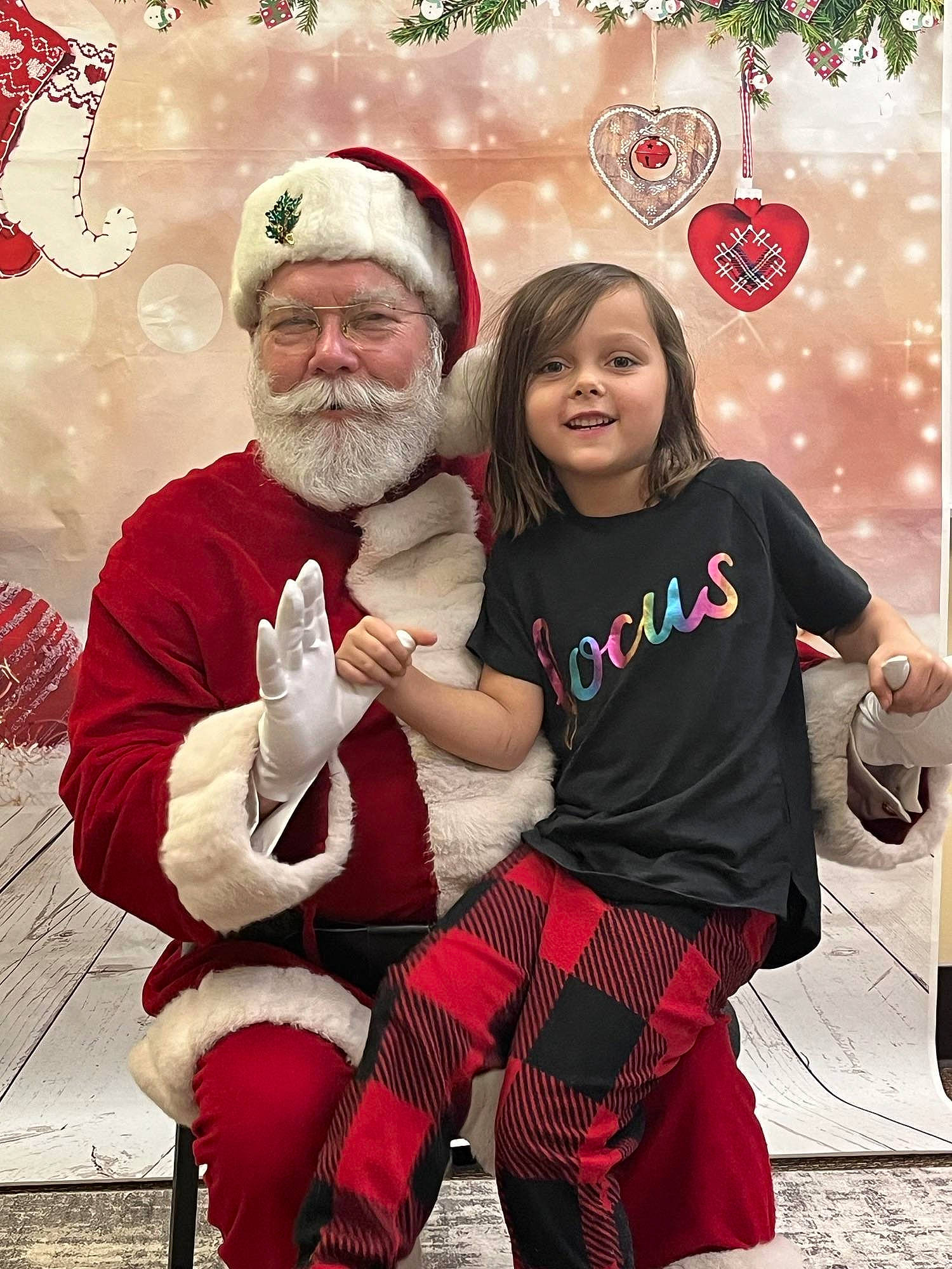 Addisyn joined the competition — help win amazing prizes! beard, christmas, christmas_decoration, christmas_eve, christmas_ornament, event, fictional_character, fun, happy, hat, headwear, holiday, joy, knee, lap, person, red, santa_claus, smile, sock