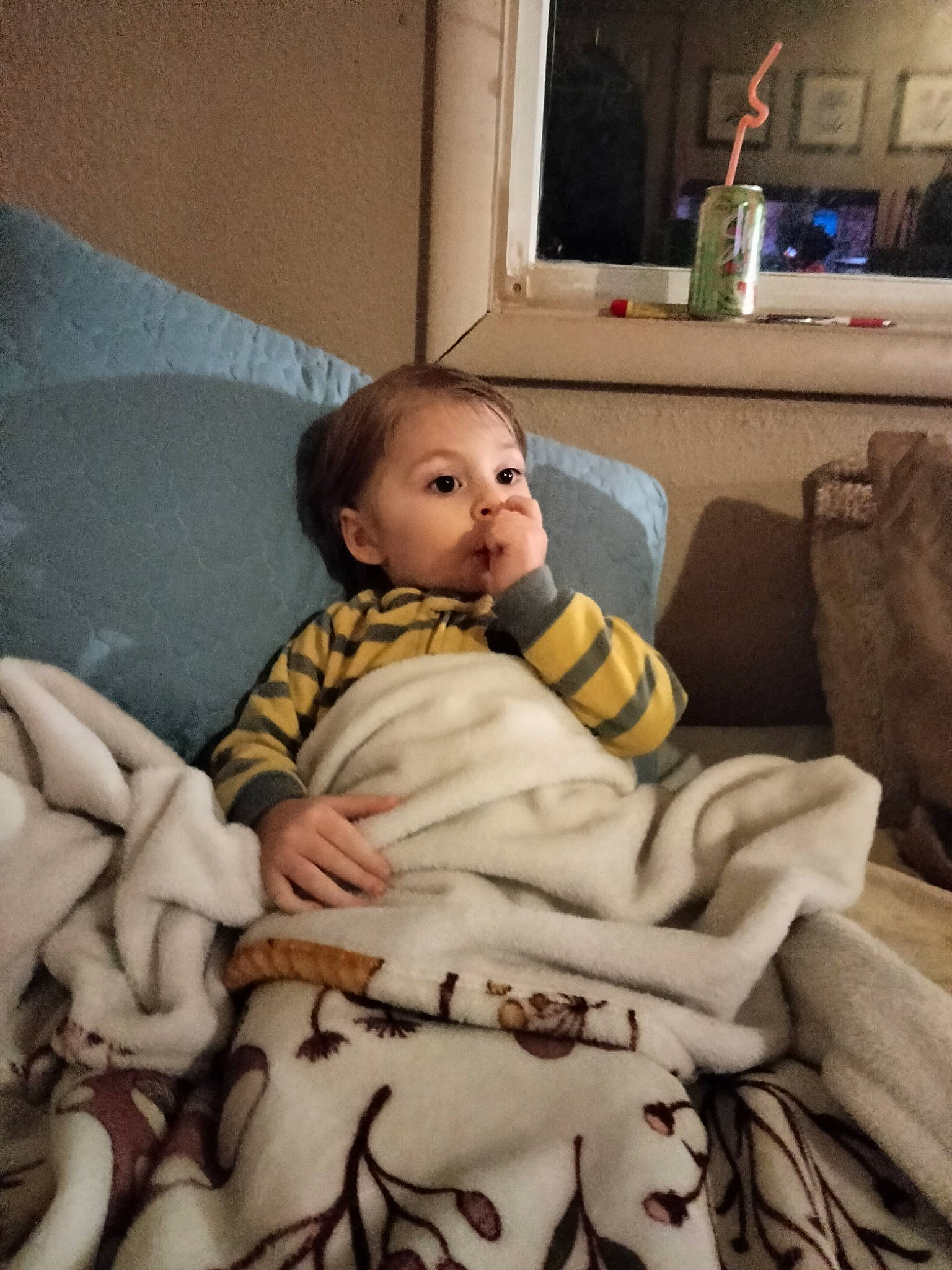 Skyler is registered to the contest to win money with this photo: art, baby, bedding, chair, chest, child, comfort, couch, eye, fur, lamp, linens, person, room, sitting, television, throw_pillow, toddler, vacation, window