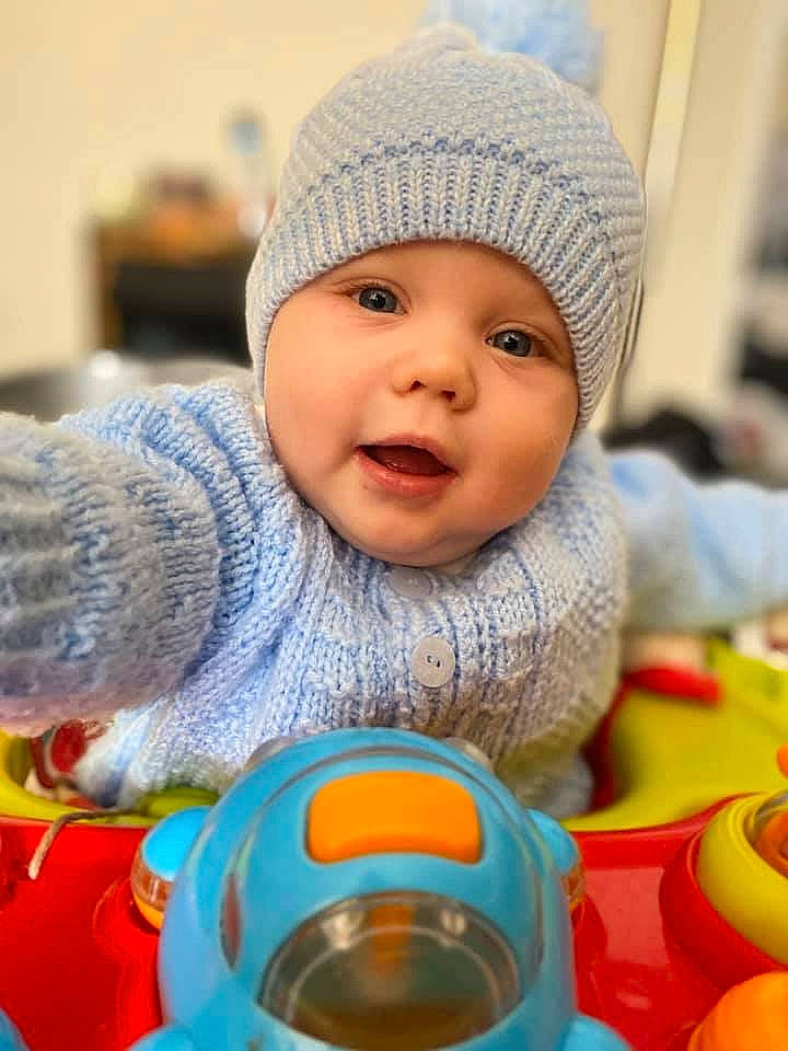 Cohan joined the competition — help win amazing prizes! baby, bonnet, cheek, child, fun, knit_cap, person, play, smile, toddler
