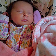 Aurora is registered to the contest to win money with this photo: baby, sleeping, blanket, floral, pillow, infant, cozy, cute, face, child, soft, warm, bed, clothing, portrait, peaceful, rest, comfort, newborn, indoors