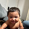 Jeremiah is registered to the contest to win money with this photo: baby, child, smiling, indoor, couch, blanket, face, person, happy, infant, arm, hair, skin, furniture, head, room, expression, closeup, toddler, home