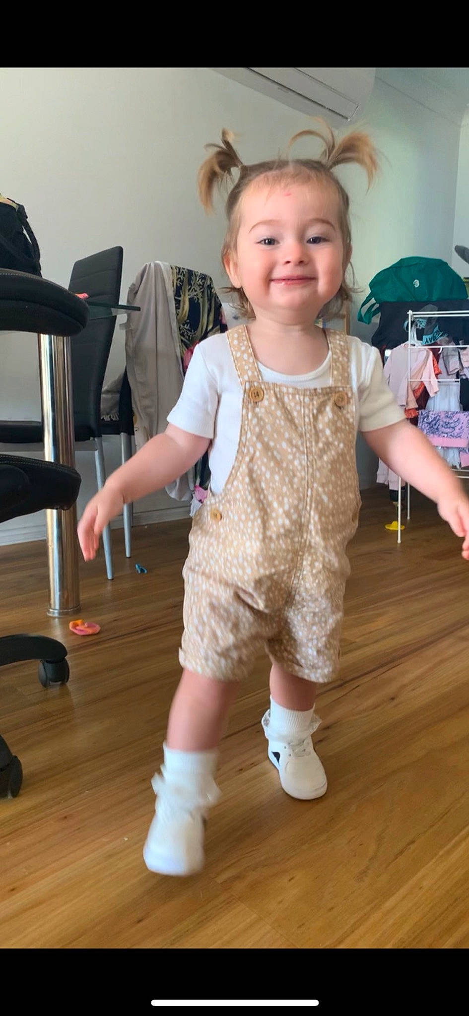 Ava Jane is registered to the contest to win money with this photo: baby_toddler_clothing, face, finger, floor, flooring, hairstyle, happy, iris, joint, joy, knee, leg, neck, person, shoulder, skin, sleeve, smile, standing, toddler