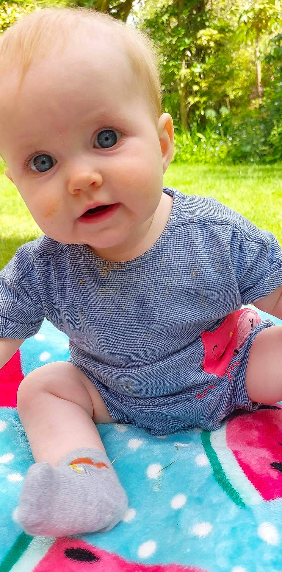 Maisie joined the competition — help win amazing prizes! baby, baby_toddler_clothing, blue, cheek, child, eye, facial_expression, grass, green, happy, iris, lip, nose, person, photograph, pink, product, skin, sleeve, summer