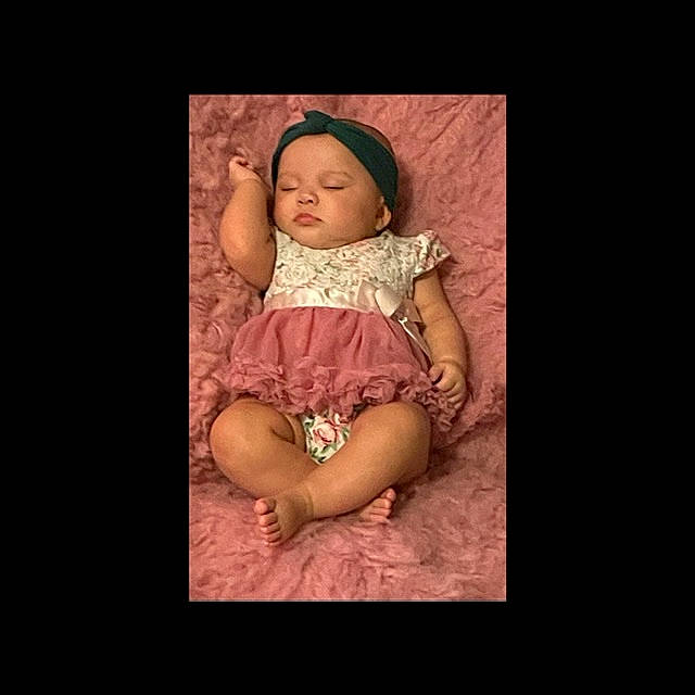 Jazlyn is registered to the contest to win money with this photo: arm, baby_toddler_clothing, cheek, chin, clothing, comfort, dress, eye, eyebrow, flash_photography, hair, happy, headwear, iris, leg, lip, mouth, neck, person, sleeve