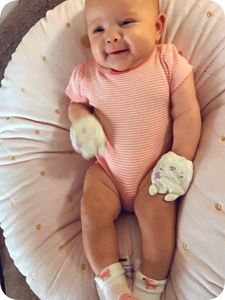 Jazlyn is registered to the contest to win money with this photo: baby, baby_toddler_clothing, beauty, cheek, child, comfort, hand_fan, happy, headwear, iris, joy, organ, person, photograph, pink, skin, sleeve, smile, stomach, textile