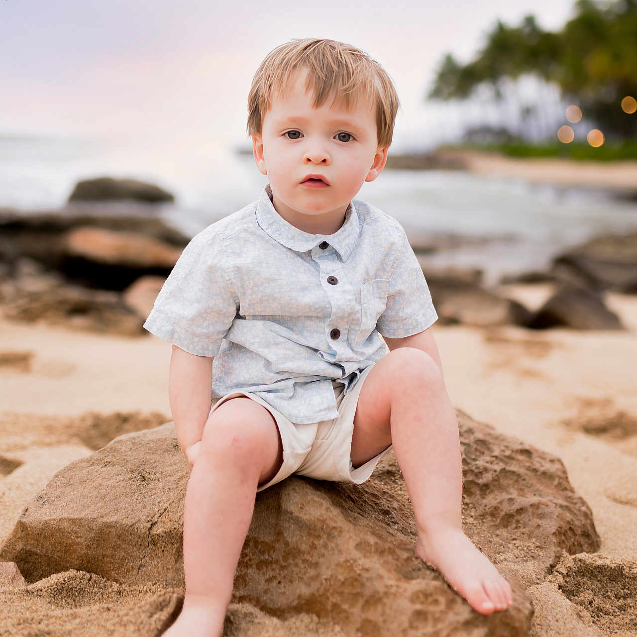 Lucas is registered to the contest to win money with this photo: beach, beachwear, boy, child, clothing, coast, face, head, male, nature, outdoors, pants, person, photography, portrait, sea, shoreline, shorts, sitting, water