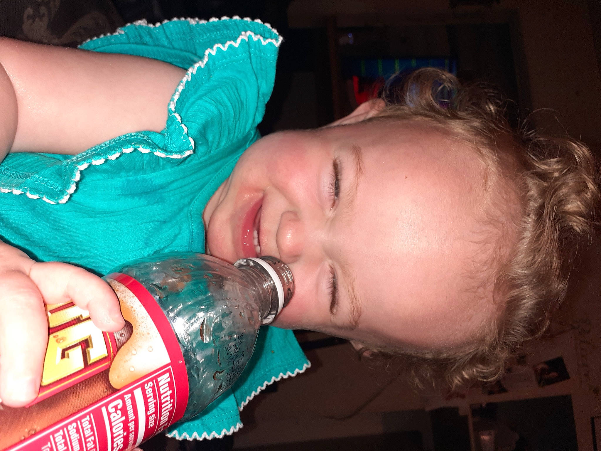 Nevaeh joined the competition — help win amazing prizes! alcoholic_beverage, beer, bottle, cool, distilled_beverage, drink, drinking, drinkware, electric_blue, facial_expression, finger, fun, hair, happy, mouth, nail, person, skin, smile, water