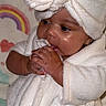 baby, child, infant, robe, headwrap, fluffy, soft, hands, face, chewing, cute, indoors, pastel, rainbow, heart, blanket, skin, portrait, warm, snuggly